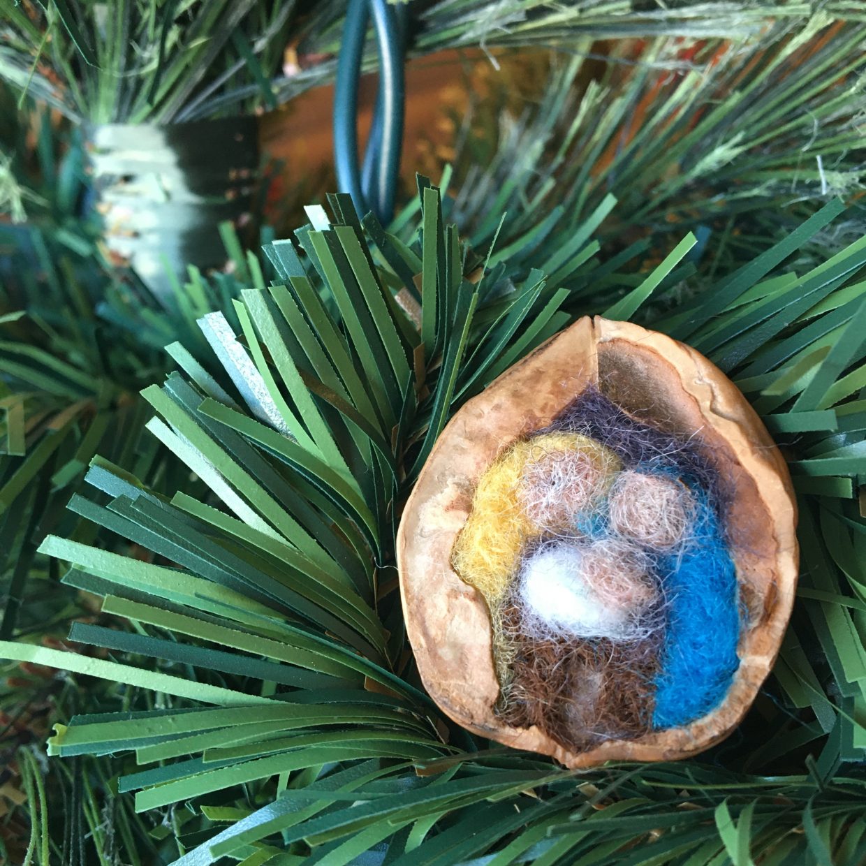 felted nativity in a walnut shell